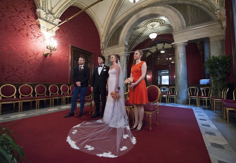 Bride, groom and two witnesses in Red wedding Hall in Campidoglio