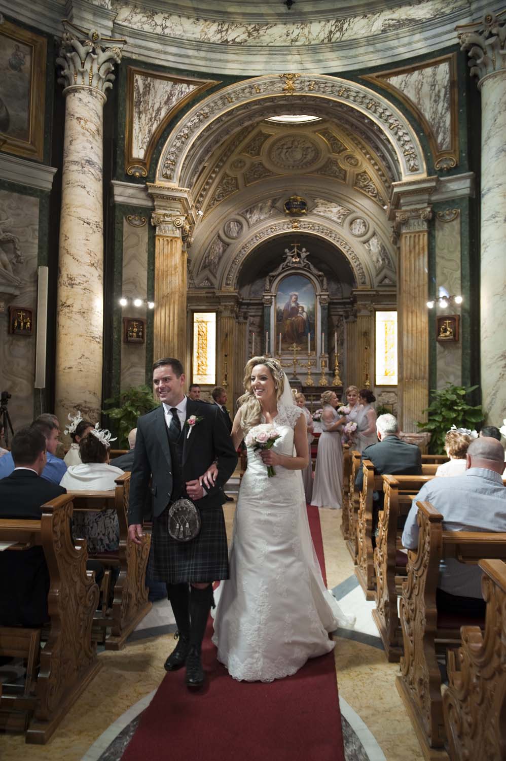 Bride and groom exit from the Church in Vatican, Rome