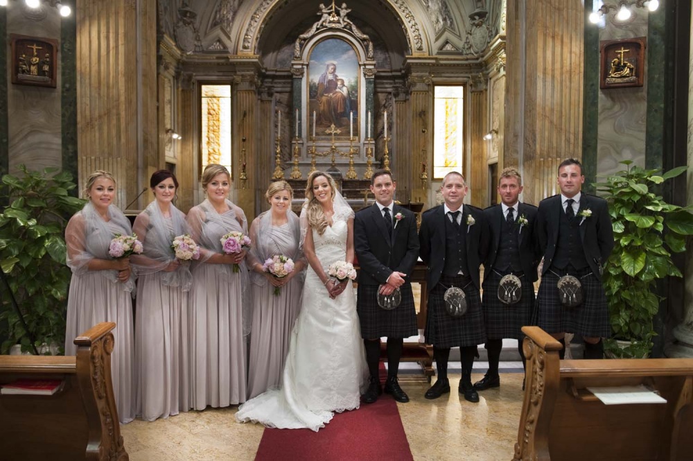 Bridesmaids and groomsmen in a portrait in the church in Rome