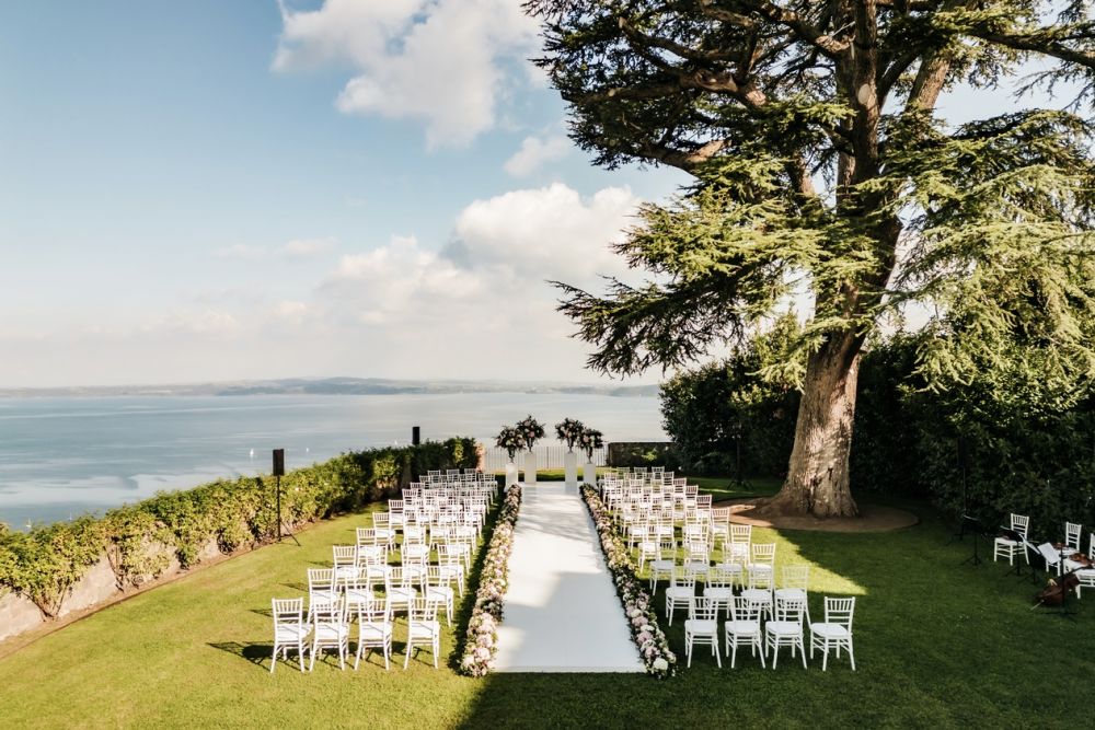 Ceremony with lake view at wedding castle in Rome