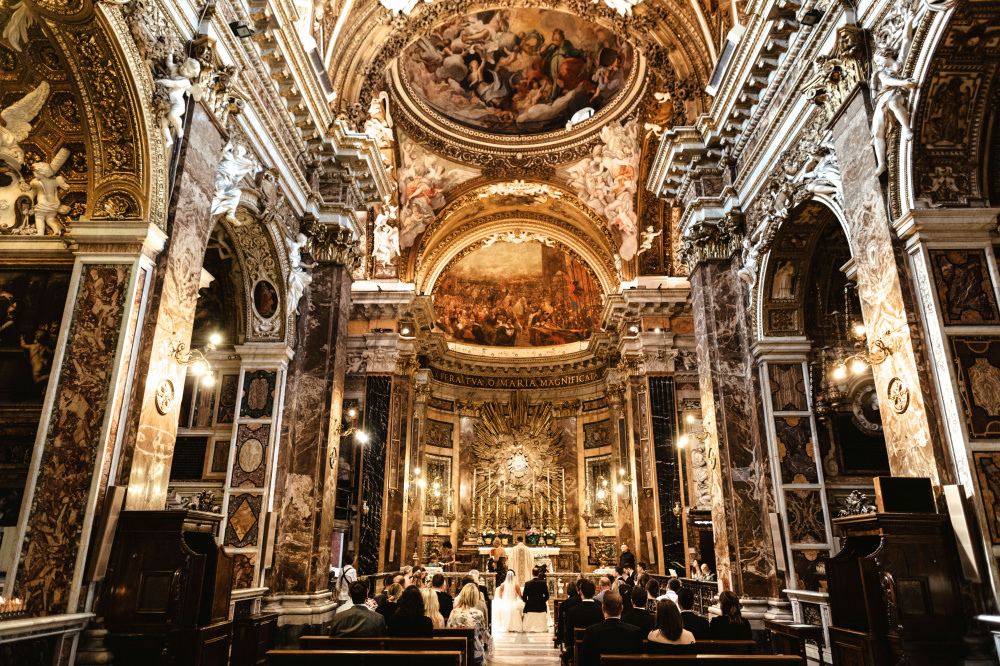 View from main entrance of beautiful baroque style catholic church for weddings in rome