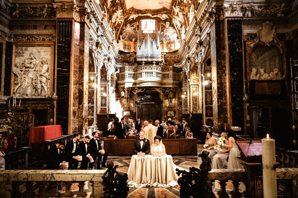 View from altar during catholic wedding ceremony in a beautiful baroque-style church in Rome