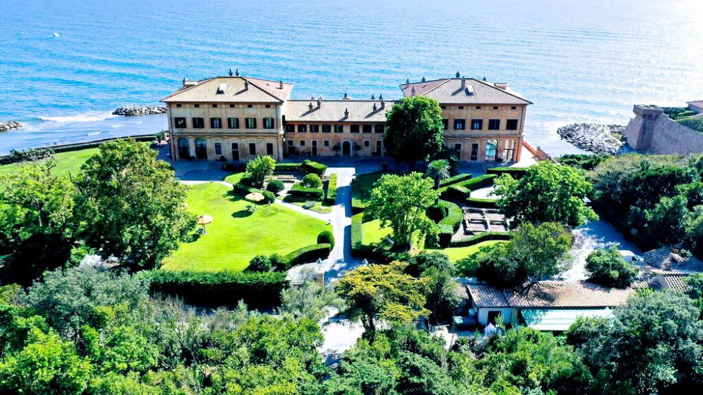 An aerial view of a stunning historical venue ideal for intimate weddings near Rome by the sea