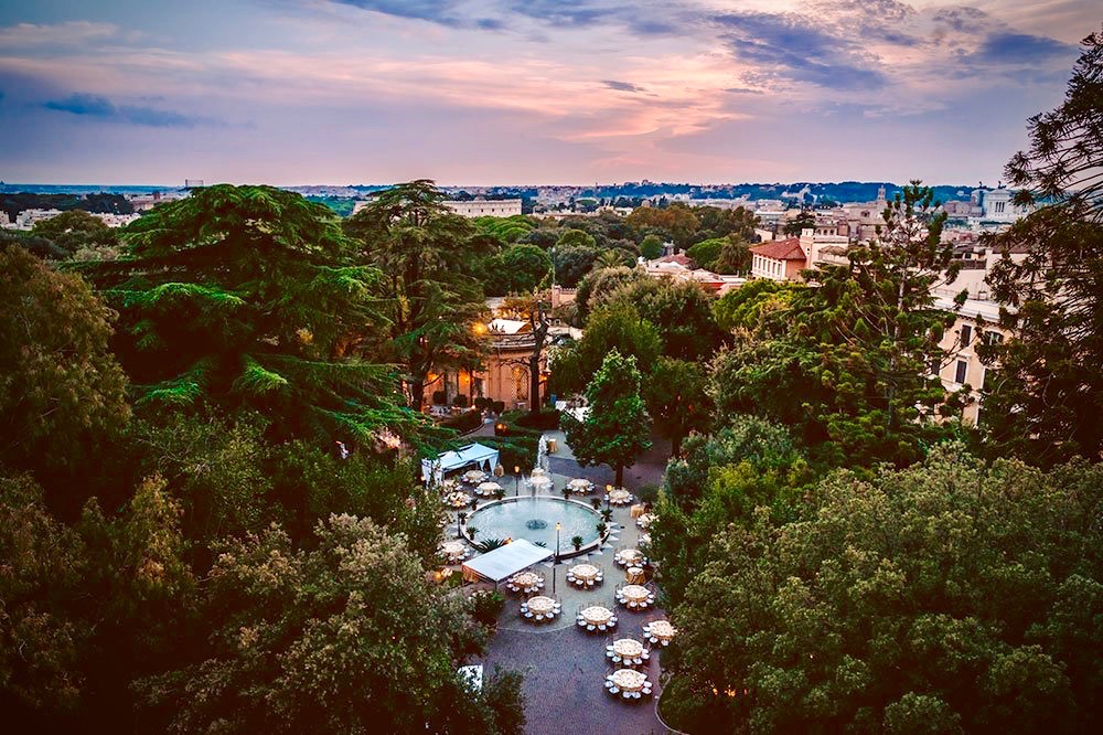 an aerial view of the verdant park of the palace in amanzing destinatio location in rome