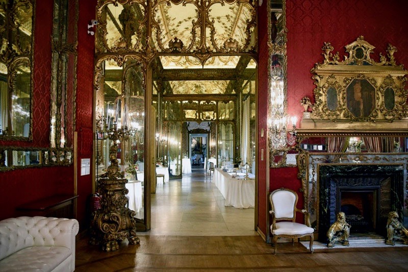 A rich adorned and fine decorated entrance of wedding hall with fabulous antique forniture