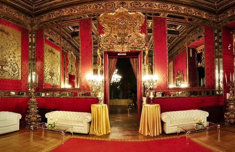 details of furniture, rede velvet walls and mirrors in sumptuous hall for weddings in Rome