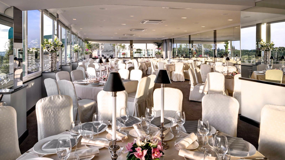 crystal lounge elegant wedding set up all white tablecloth and chairs fresh pink roses centerpieces