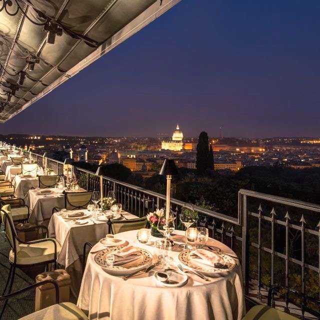 Elegant dining on the terrace overloonking St Peter by night for romantic open air for wedding