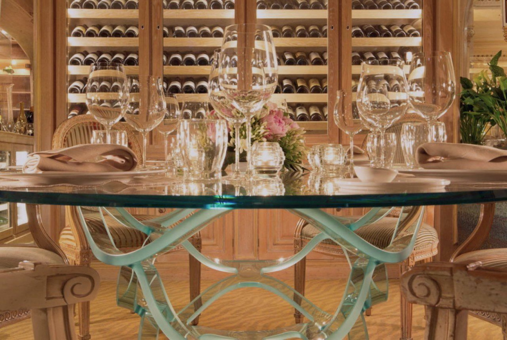 wine cellar detail of impressive crystal table dinner set up with fresh flowers for intimate wedding