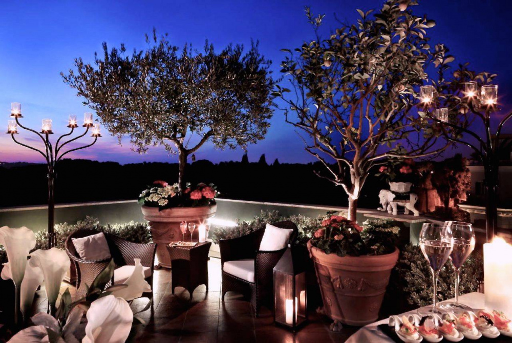 stylish roof top terrace loung bar by night with view