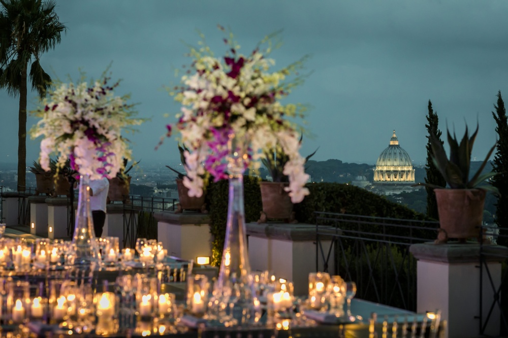 Wedding decor with orchids, candles and mirror tables