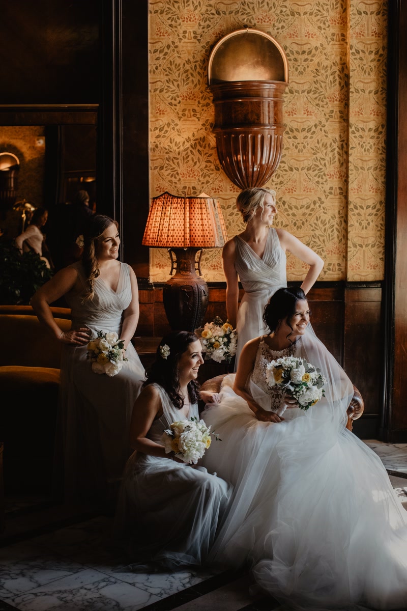 Bride and bridesmaids in a portrait at the hotel lobby