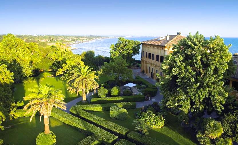 Aerial view wedding villa's entrance big variety of exotic trees and the sea as background