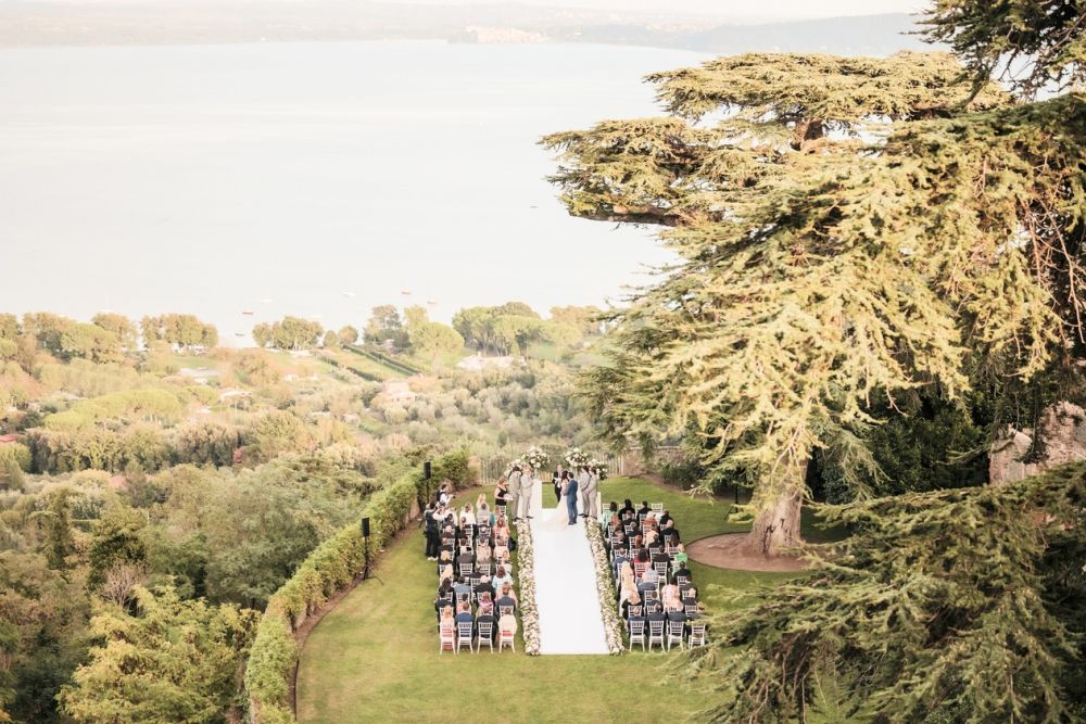 View of ceremony with lake view at wedding castle in Rome