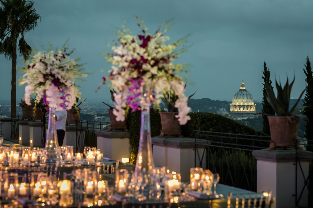 Villa Wedding decor with white orchids, candles and mirror tables with Rome view a stunning wedding