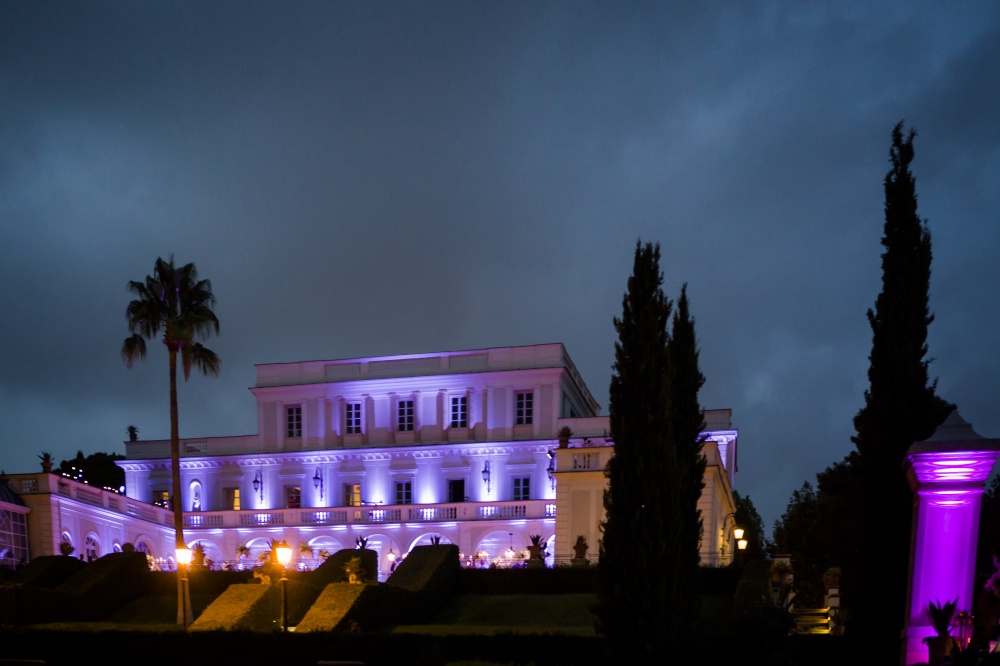 Villa wedding Rome night view with amanzing pink and purple lighting on the facade