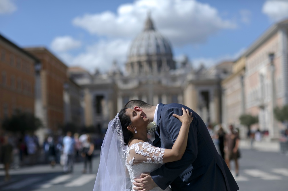 Bride and groom in a romantic hug in Vatican Rome