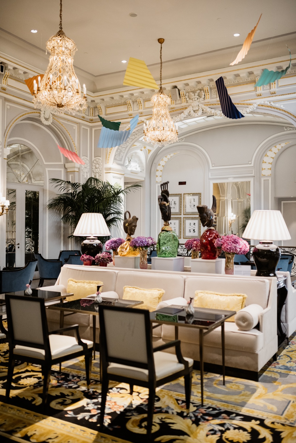 Elegant lounge area with colored details and white sofas perfect for wedding portraits